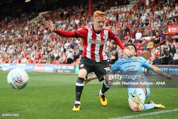 Ryan Woods of Brentford and Ruben Vinagre of Wolverhampton Wanderers during the Sky Bet Championship match between Brentford and Wolverhampton...