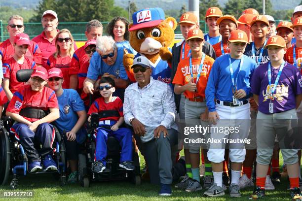 Hall of Fame Reggie Jackson poses for a photo with participants of the the 2017 Little League World Series Challenger Division game at Volunteer...