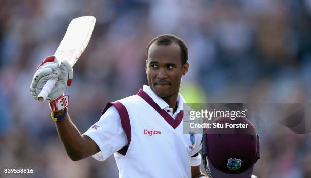 West Indies batsman Kraigg Brathwaite raises his bat as he leaves the field after being dismissed for 134 runs during day two of the 2nd Investec...