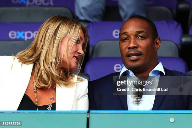 Paul Ince looks on next to his wife Claire during the Premier League match between Huddersfield Town and Southampton at the John Smith's Stadium on...