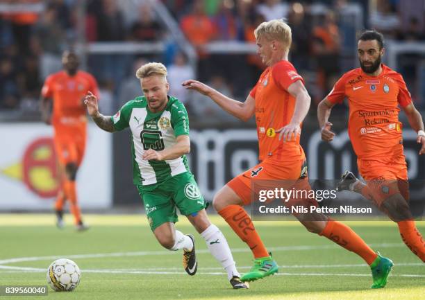 Sander Svendsen of Hammarby IF and Ludvig Ohman Silwerfeldt of Athletic FC Eskilstuna competes for the ball during the Allsvenskan match between...