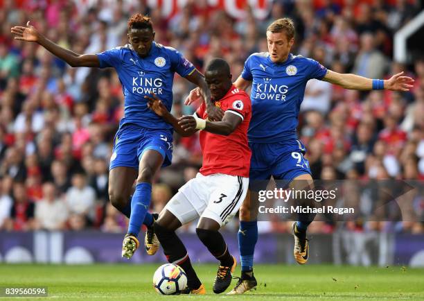 Wilfred Ndidi of Leicester City and Jamie Vardy of Leicester City battle for possession with Eric Bailly of Manchester United during the Premier...