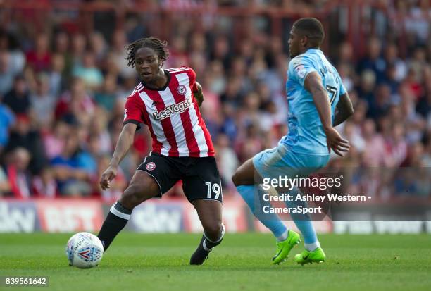 Brentford's Romaine Sawyers battles for possession with Wolverhampton Wanderers' Ivan Cavaleiro during the Sky Bet Championship match between...