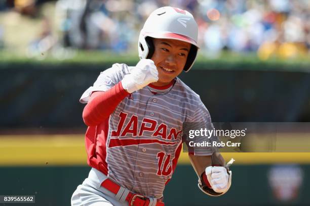 Keitaro Miyahara of Japan celebrates after hitting a solo home run against Mexico during the International Championship game of the Little League...