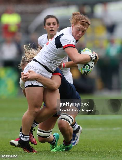 Alev Kelter of The USA is tackled by Marjorie Mayans of France during the Women's Rugby World Cup 2017 Third Place Match between France and The USA...
