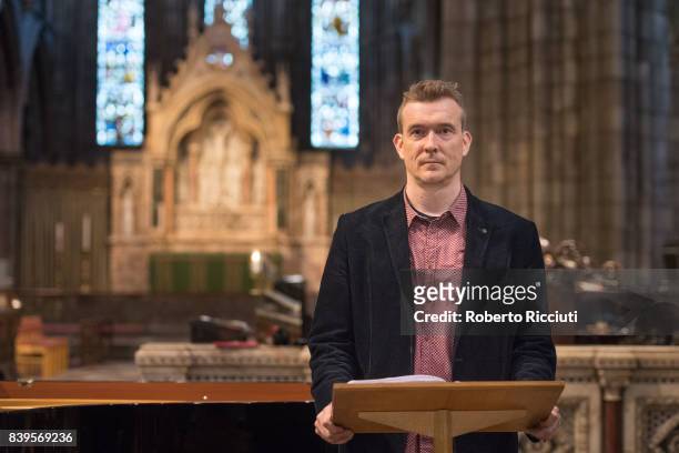 English novelist David Mitchell attends a photocall during the annual Edinburgh International Book Festival at St Mary's Cathedral on August 26, 2017...