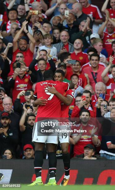 Marcus Rashford of Manchester United celebrates scoring their first goal during the Premier League match between Manchester United and Leicester City...