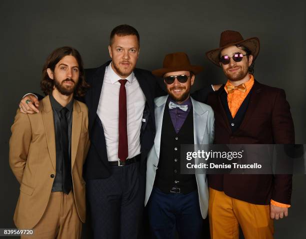 Guitarist Wayne Sermon, singer Dan Reynolds, bassist Ben McKee and drummer Daniel Platzman of Imagine Dragons arrive at the Tyler Robinson...