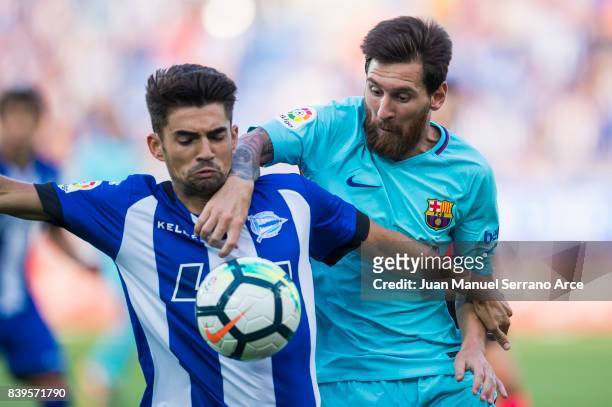 Lionel Messi of FC Barcelona duels for the ball with Enzo Zidane of Deportivo Alaves during the La Liga match between Deportivo Alaves and Barcelona...