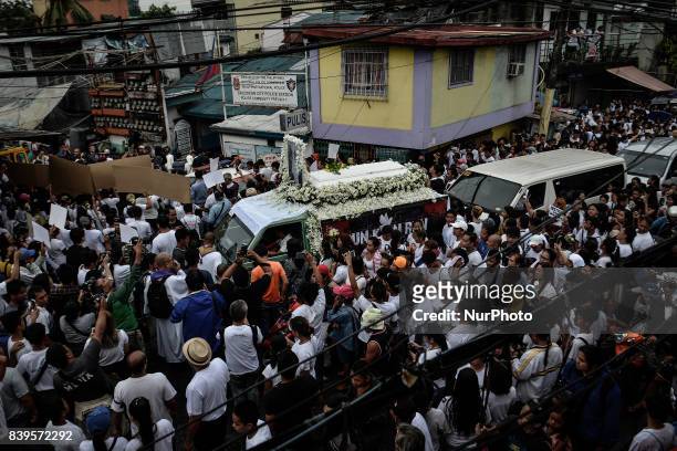 Relatives and friends take part in the funeral procession of Kian Loyd Delos Santos in Caloocan, Metro Manila, Philippines, August 26, 2017. Amidst...
