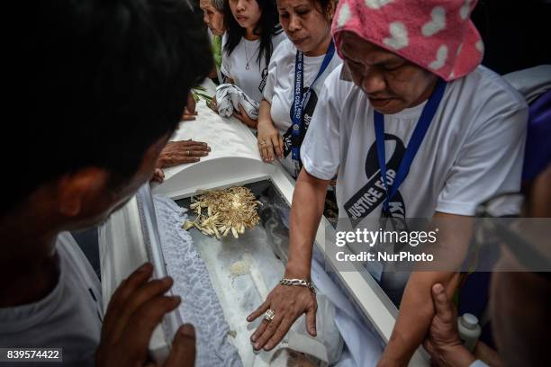 Parents and relatives of Kian Loyd Delos Santos pay their last respects during his funeral rites in Caloocan, Metro Manila, Philippines, August 26,...