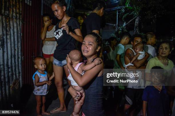 Woman weeps after her partner was killed by police following a police operation against illegal drugs in Caloocan, Metro Manila, Philippines, August...