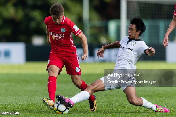 Torres Sartori Igor of Wofoo Tai Po fights for the ball with Kwok Wai Leung of Dreams FC during the Dreams FC vs Wofoo Tai Po match of the week one...