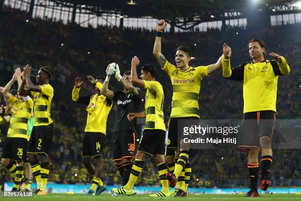 Marc Bartra of Dortmund , Roman Weidenfeller of Dortmund and players of Dortmund celebrate with their fans after the Bundesliga match between...