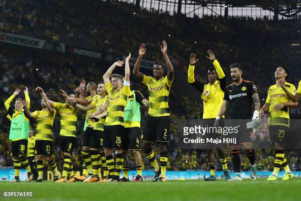Lukasz Piszczek of Dortmund and Dan-Axel Zagadou of Dortmund and players of Dortmund celebrate with their fans after the Bundesliga match between...