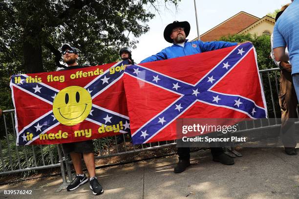 Small number of pro-confederate supporters face off against hundreds of demonstrators against a Confederate memorial monument in Fort Sanders as...