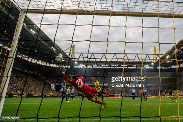 Nuri Sahin of Dortmund scores his team's second goal against Rune Jarstein goalkeeper of Hertha to make it 2:0 during the Bundesliga match between...