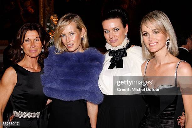 Sylvie Rousseau, Estelle Lefebure, Princesse Kasia Al Thani and Laetitia Halliday attend the Niut de l'Enfance at Chateau de Versailles on December...