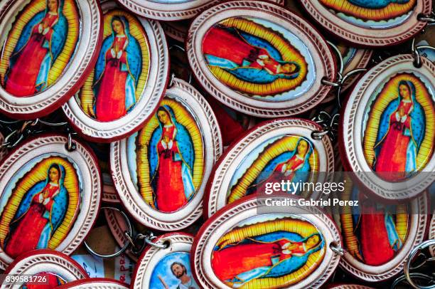 our lady of guadalupe buttons - mexican catholic stock pictures, royalty-free photos & images