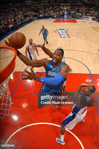 Dwight Howard of the Orlando Magic goes up for a dunk against Zach Randolph of the Los Angeles Clippers at Staples Center on December 8, 2008 in Los...