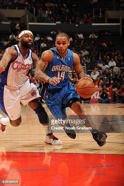 Jameer Nelson of the Orlando Magic gets into the paint against Baron Davis of the Los Angeles Clippers at Staples Center on December 8, 2008 in Los...