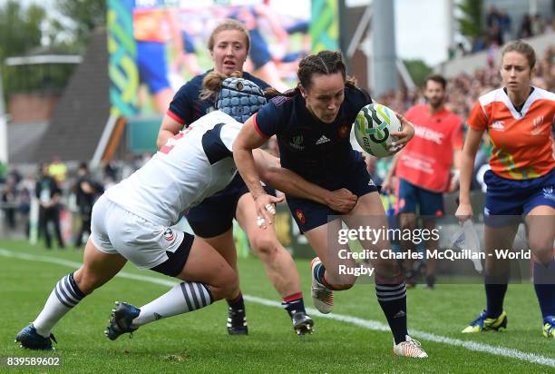 Jade Le Pesq of France breaks past the tackle of Kathryn Augustyn of The USA to score a try during the Women's Rugby World Cup 2017 Third Place Match...