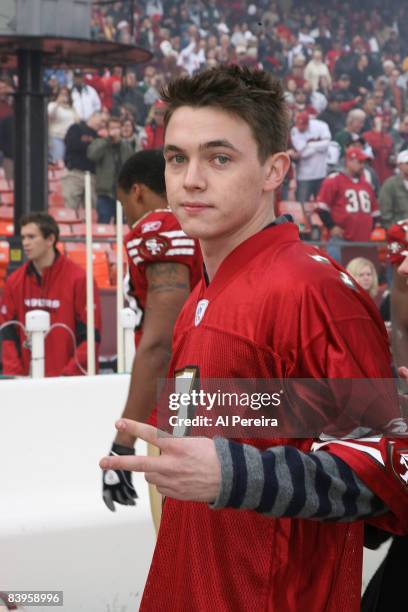 Singer Jesse McCartney checks out the action from the sideline before singing the National Anthem when the New York Jets visit the San Francisco...