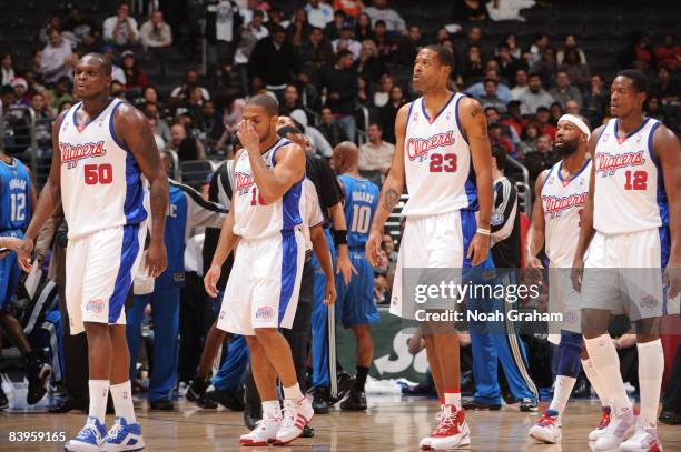 Zach Randolph, Eric Gordon, Marcus Camby, Baron Davis, and Al Thornton of the Los Angeles Clippers stand on the court during the game against the...