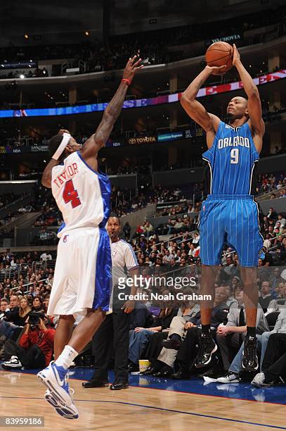 Rashard Lewis of the Orlando Magic shoots against Mike Taylor of the Los Angeles Clippers at Staples Center on December 8, 2008 in Los Angeles,...