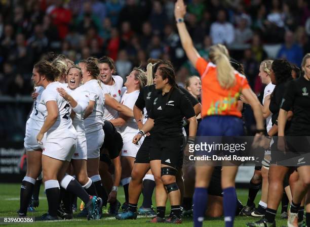 England players celebrate after being awarded a penalty try during the Women's Rugby World Cup 2017 Final between England and New Zealand on August...