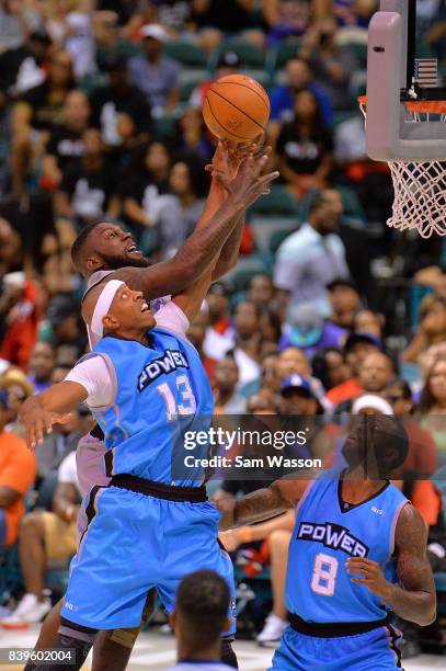 Ivan Johnson of the Ghost Ballers, fights for a rebound with Jerome Williams of the Power, during the BIG3 three on three basketball league runner-up...