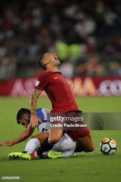 Alekxandar Kolarov of AS Roma competes for the ball with Antonio Candreva of FC Internazionale during the Serie A match between AS Roma and FC...