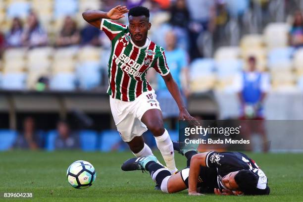 Jefferson Orejuela of Fluminense struggles for the ball with Andres Rios of Vasco da Gama during a match between Fluminense and Vasco da Gama as part...