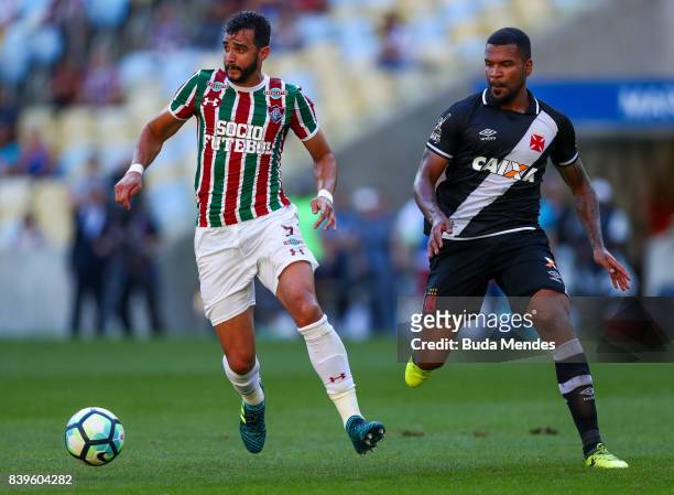 Henrique Dourado of Fluminense struggles for the ball with and Breno of Vasco da Gama during a match between Fluminense and Vasco da Gama as part of...