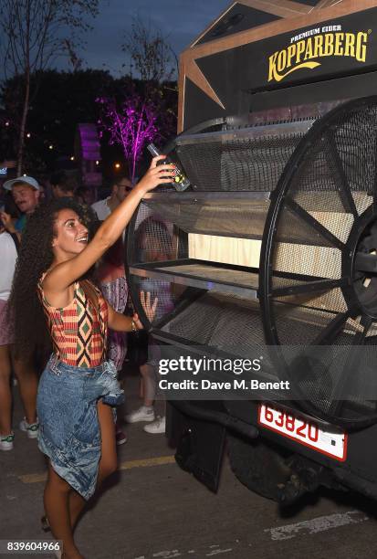 Party-goers trade in their empties to power the music on Kopparbergs Recycling Rig at Number 90 in Hackney Wick on August 26, 2017 in London,...