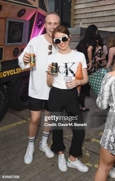 Party-goers trade in their empties to power the music on Kopparbergs Recycling Rig at Number 90 in Hackney Wick on August 26, 2017 in London,...