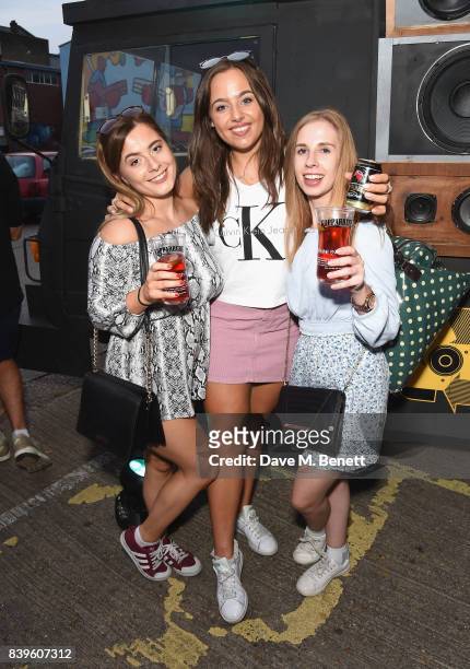 Party-goers trade in their empties to power the music on Kopparbergs Recycling Rig at Number 90 in Hackney Wick on August 26, 2017 in London,...