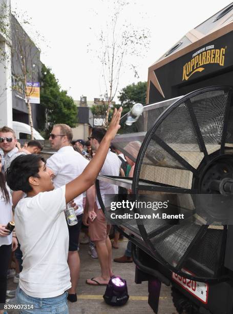 Party-goers trade in their empties to power the music on Kopparbergs Recycling Rig at Number 90 in Hackney Wick on August 26, 2017 in London,...