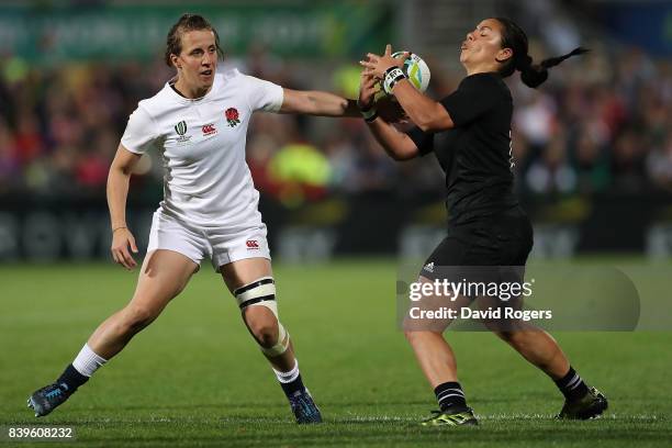 Katy Mclean of England and Stacey Waaka of New Zealand battle for possession during the Women's Rugby World Cup 2017 Final between England and New...