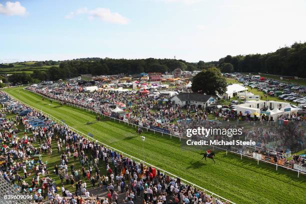 Robert Hogg riding Beeno passes the winning post as he wins the totepool Cartmel Cup Handicap Hurdle Race at Cartmel Racecourse on August 26, 2017 in...