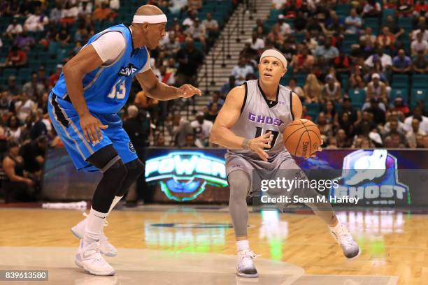 Mike Bibby of the Ghost Ballers, drives with the ball against Jerome Williams of the Power, during the BIG3 three on three basketball league...