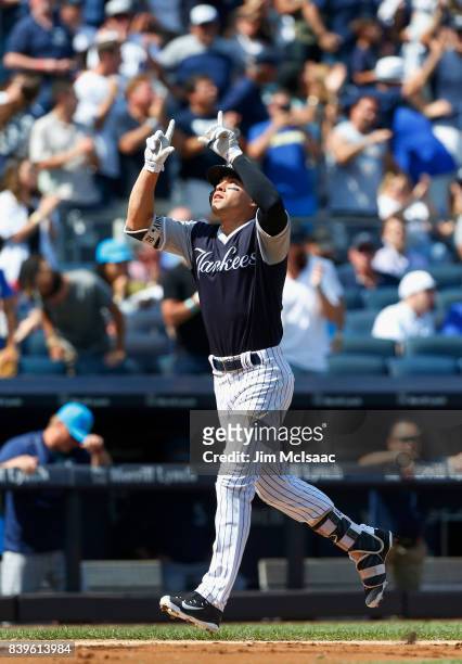 Jacoby Ellsbury of the New York Yankees celebrates his fourth inning three run home run against the Seattle Mariners at Yankee Stadium on August 26,...