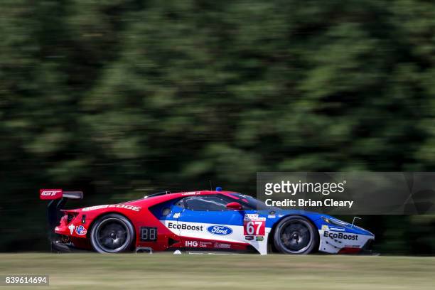 The Ford GT of Richard Westbrook, of Great Britain, and Ryan Briscoe, of Australia, races on the track during practice for the Michelin GT Challenge...