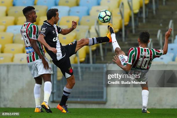 Jefferson Orejuela and Gustavo Scarpa of Fluminense struggle for the ball with Nene of Vasco da Gama during a match between Fluminense and Vasco da...