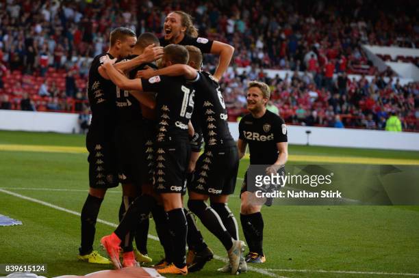 Leeds United players celebrate after scoring the second goal during the Sky Bet Championship match between Nottingham Forest and Leeds United at City...