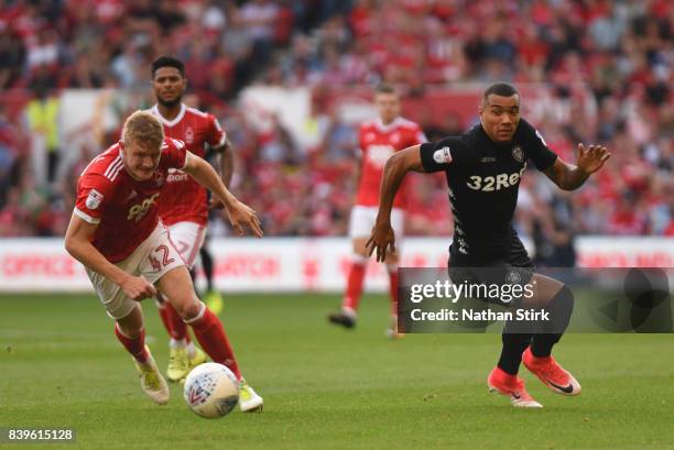 Jay-Roy Grot of Leeds United and Joe Worrall of Nottingham Forest in action during the Sky Bet Championship match between Nottingham Forest and Leeds...