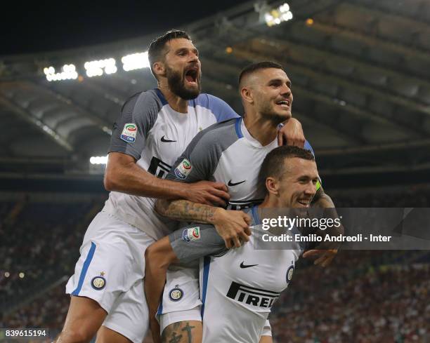 Mauro Emanuel Icardi of FC Internazionale Milano celebrates his second goal with his team-mates Antonio Candreva and Ivan Perisic during the Serie A...