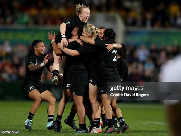 New Zealand players celebrate after winning the Women's Rugby World Cup 2017 Final between England and New Zealand on August 26, 2017 in Belfast,...