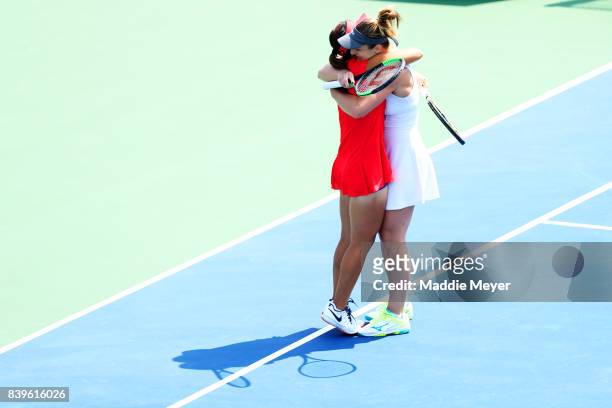 Gabriela Dabrowski of Canada and Yifan Xu of China celebrate after defeating Ashleigh Barty and Casey Dellacqua of Australia during Day 9 of the...