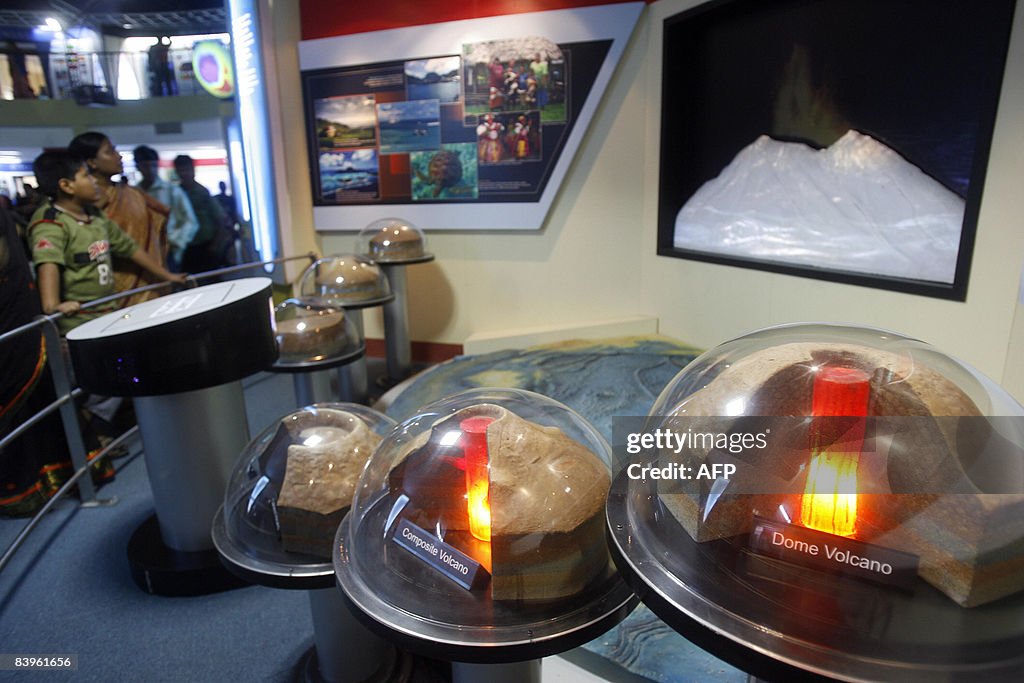 Indian visitors look at exhibits at the